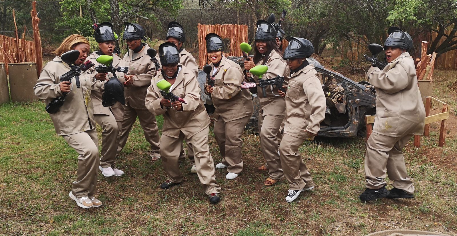 A corporate team geared up on the paintball field at Legends